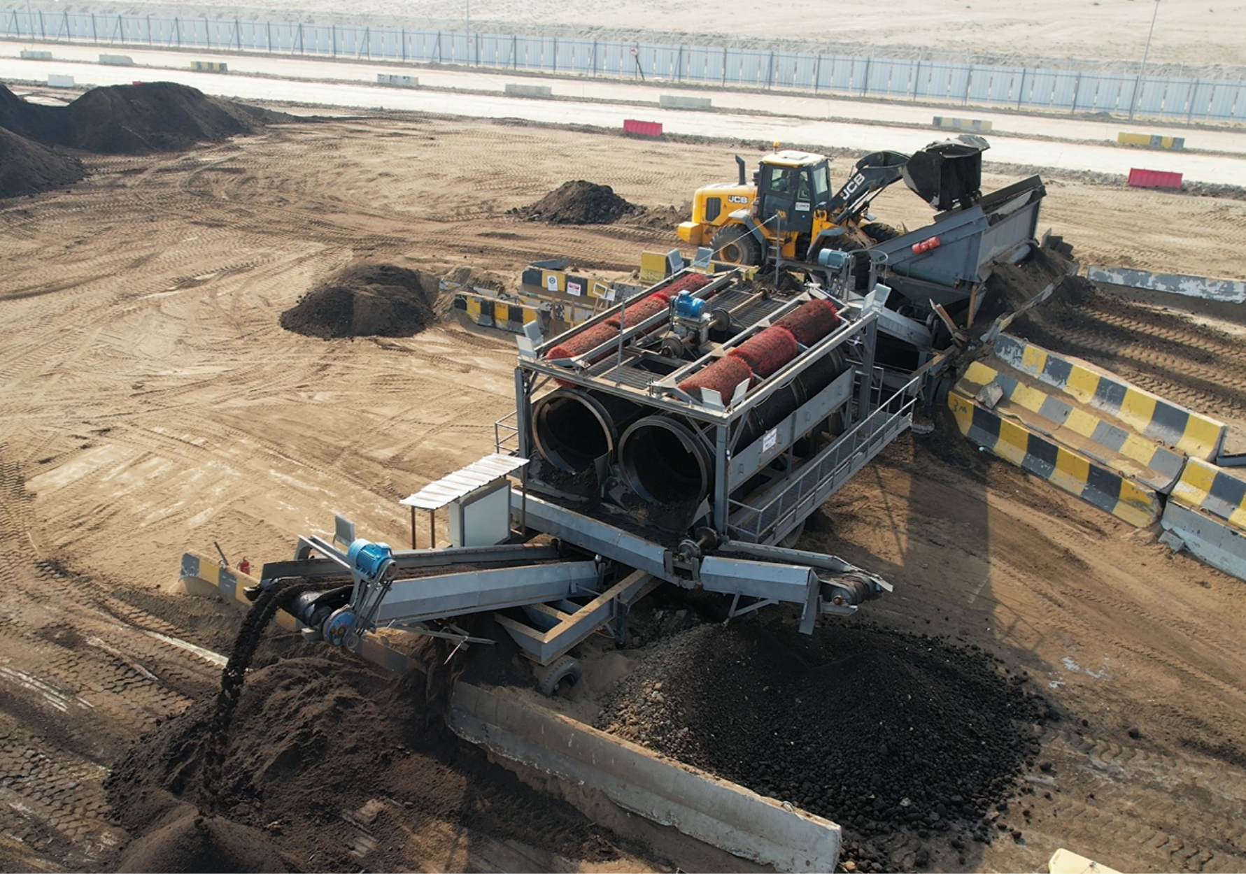 Double trommel Mobile Screening Unit - Wet oil Contaminated Material Image